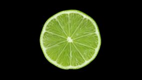 Lime citrus. Lime on black background, rotate. 4K UHD video