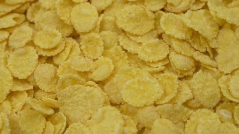 Cornflakes, Healthy Breakfast, Close-up. Insulated Cornflakes. Background of Yellow Cornflakes. Healthy Vegan Vitamin Food and Nutrition.