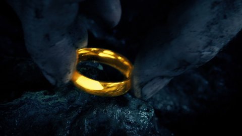Gold Ring Picked Up And Falling On Rocks Video de stock