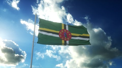 Flag of Dominica waving at wind against beautiful blue sky