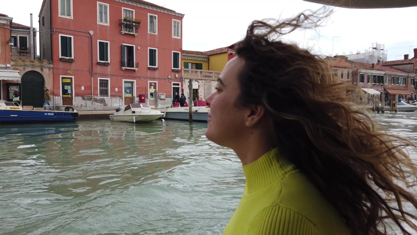 Lady woman tourist by boat ferry watch the beauty of the city of the city of love in the Grand Canal Venice