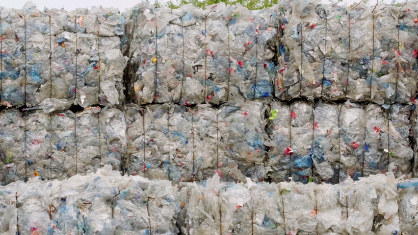 Compressed bundles of plastic bottles at the recycling center. Royalty-Free Stock Footage #1082431270