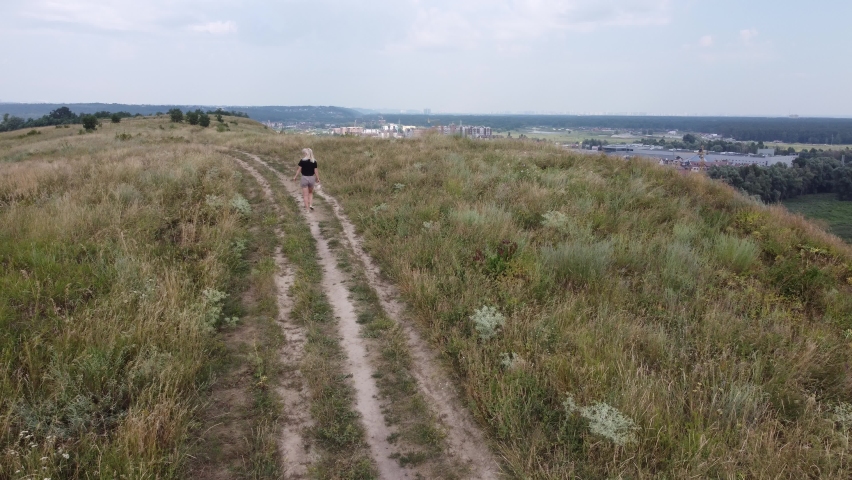 hilly landscape. Beautiful view with hills, clouds and trees. The nature.
