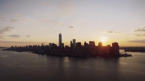 Towards Lower Manhattan Famous Skyscrapers Over Orange Sunrise Warm Sky From New York Harbor