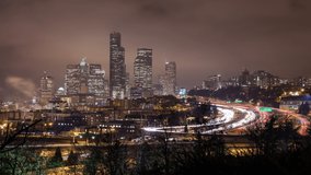Time lapse of traffic on the freeway looking toward Skyscrapers in Seattle and Centurylink Field