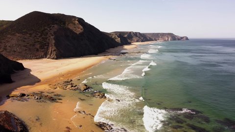 Distant footage of the coast of Alentejo, in Praia da Barriga, Portugal. Perfect for surf or tourism videos.