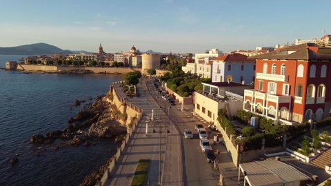 Aerial shot of the ancient coastal city Alghero in Italy. A popular tourist destination
