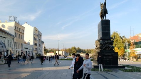 Nis, Serbia - 10 27 2021: King Milan square on a sunny autumn day, with a monument of Liberators of Nis in the foreground.