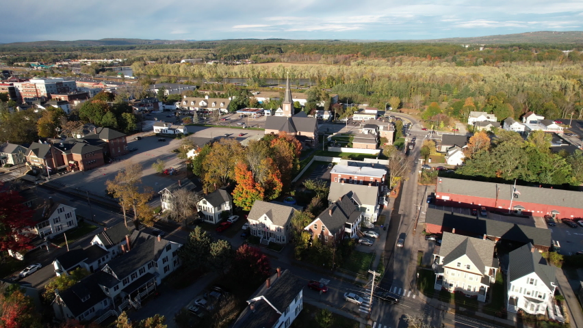 Flying Above Residential Neighborhood and Church in Concord, New Hampshire USA. Cityscape on Sunny Autumn Day, Drone Aerial View