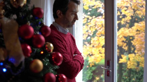 Worried man suffering Christmas stress and anxiety