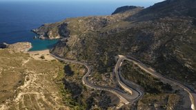 Aerial drone video of winding road leading to iconic paradise beach of Melidoni, Kythera island, Ionian, Greece