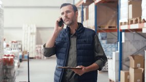 Caucasian warehouse worker using mobile phone. Shot with RED helium camera in 8K - Powered by Shutterstock - Get 15% off with code: PIKWIZARD15