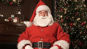Santa Claus greeting to Merry Christmas and Happy New Year. Emotion of happiness and joy, holiday atmosphere. Online remote communication. Video chat conference. Modern technology. Webcam view 4K