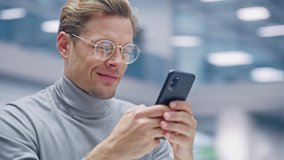 Office 360 Degree: Portrait of Creative Businessman Sitting at His Desk Using Smartphone. Digital Entrepreneur Using Mobile Phone, Internet e-Commerce Online Shopping. Tracking Moving Around Shot - Powered by Shutterstock - Get 15% off with code: PIKWIZARD15