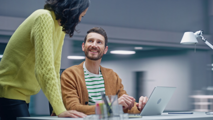 360 Degree Office: Business Meeting of Two Businesspeople Talking at the Desk. Businessman and Businesswoman Work on Strategy, Brainstorm for e-Commerce Software Design. Moving Around Tracking Shot - Powered by Shutterstock - Get 15% off with code: PIKWIZARD15