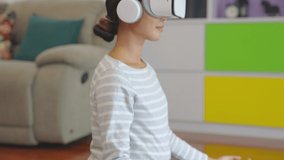 Healthy and happy Asian pregnant woman using VR glasses for online yoga class. Yoga at home by yourself Exercise, relax, meditate, stretch. Easy childbirth. pregnant female playing sports concept.