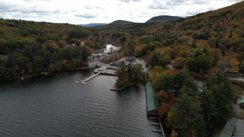 Aerial View of Newbury, New Hampshire USA, Small Town by Sunapee Lake and Colors of Autumn in Tree Foliage, Drone Shot