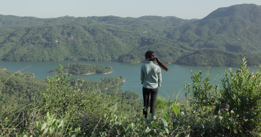 Woman go hiking and look at the view