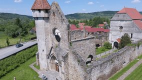 Video shot from a drone starting from the front of the ruined church, picking altitude and revealing the entire ruin. Abatia monastery from Carta, Sibiu county, Romania.
