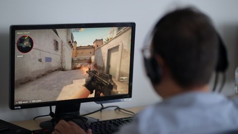 Kyiv, Ukraine 10 June 2021: the guy is playing the game Counter-Strike on the computer. Gamer plays Counter-Strike on a computer