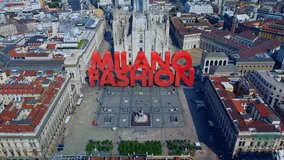 Intro to the video with the name of the city in 3D technique. Cathedral area. Aerial view of the city. Week of fashion, design, art, wine. Tourism. Milan, Italy 