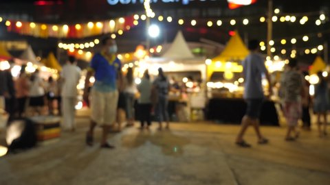 
Slow motion of blurred busy busy fresh market full with crowd people walking in street shopping.
Thailand street food night market booth festival light bright bokeh.