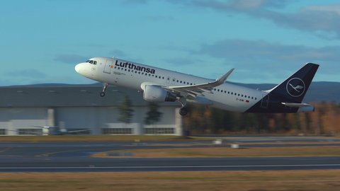 Oslo Airport Norway - October 27 2021: airplane airbus a320 lufthansa taking off runway slow motion close view