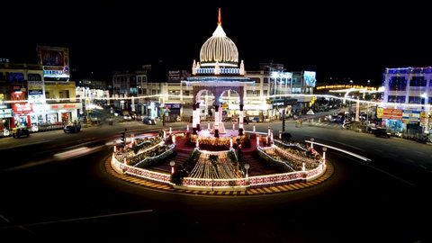 Mysuru, Karnataka, India-October 12 2021; A Time lapse video of the famous Maharajah memorial illuminated and the light trails of the blurred automobiles during Dasara festival in Mysore, India.
