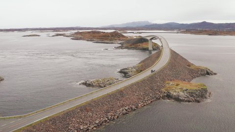 Aerial View Of Storseisundet Bridge in Atlantic Ocean Road With Cars Driving in Both Directions, Norway. - Drone shot 