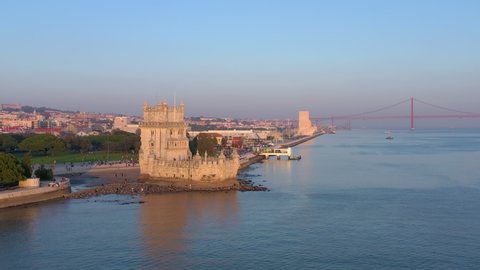 Lisbon, Portugal, aerial view of Belem Tower, Torre de Belem. By the Tagus river at sunset, Bridge 25 Abril