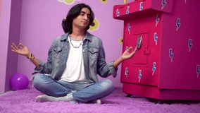 Non binary man doing yoga in his girly room. - Powered by Shutterstock - Get 15% off with code: PIKWIZARD15