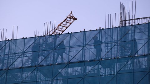 Migrant working on construction of residential building,Beijing,China.