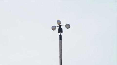 Air measuring device anemometer spinning on the wind. Meteorology.