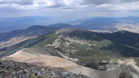 A time-lapse of clouds sweeping over the mountainous landscape of Great Basin National Park in Nevada, as seen from the summit of Wheeler Peak. To the north, Stella Lake and Bald Mountain are visible.