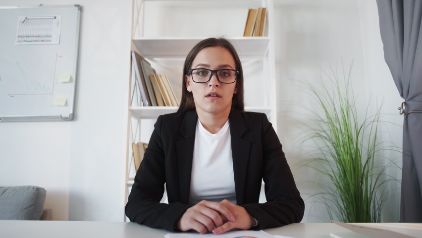 Video meeting. Corporate teleconference. Online interview. Shocked frustrated business woman listening bad statistics report clutching head at virtual office. Royalty-Free Stock Footage #1082587429
