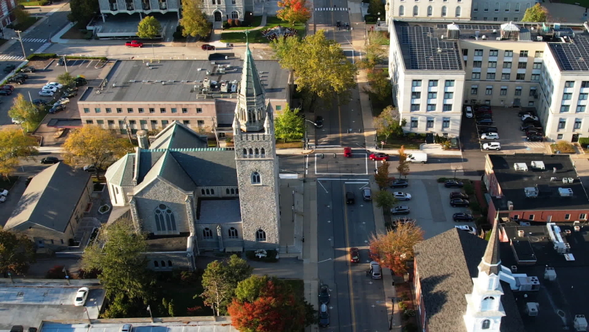 Downtown Concord, New Hampshire. Aerial View of First Church of Christ Scientist Streets and Central Neighborhood on Sunny Autumn Day, Drone Shot