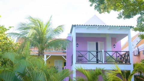 Curacao, colorful buildings around Willemstad Punda and Otrobanda Pietermaai district, multicolored homes in Pietermaai Curacao Caribean Island , couple men and woman on vacation Curacao