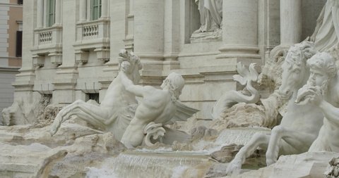 Panning left shot: Sculptural complex of the Trevi fountain in Rome. Slow motion 50fps 4k
