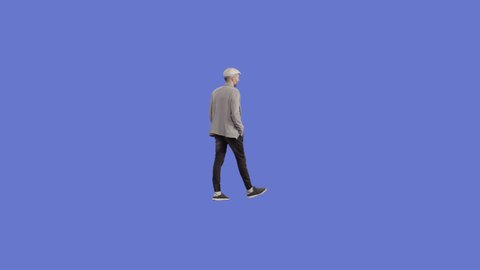 A man in a cap is walking. Perspective view. Shot on a chromakey background