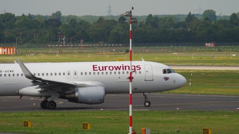 DUSSELDORF, GERMANY - JULY 23, 2017: Airbus A320 of Eurowings taxiing along the taxiway at Dusseldorf Airport (DUS). Airplane on the runway. Eurowings German low cost airline