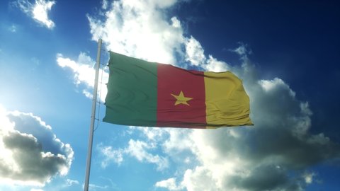 Flag of Cameroon waving at wind against beautiful blue sky