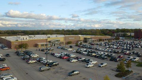 Lansing , IL , United States - 10 30 2021: Low Aerial Establishing Shot of Walmart Supercenter in American Town