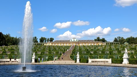 Potsdam , Brandenburg , Germany - 08 31 2021: Potsdam, Germany - August, 2021: Sanssouci Palace and fountain in Sanssouci Park, city landmark, UNESCO World Heritage Site