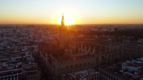 Catedral de Sevilla. Drone shot of the beautiful Spanish city of Seville at the sunrise, UHD, 4K