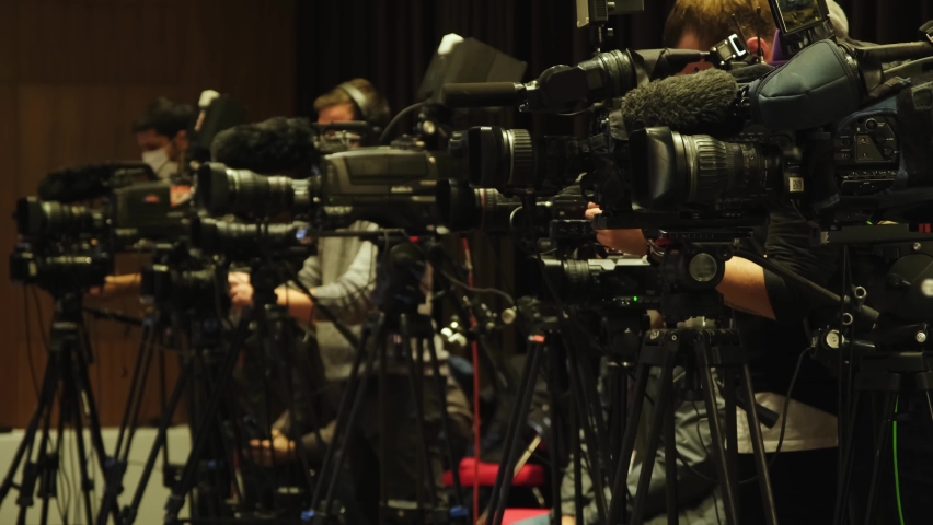 Large number of press and media reporter in broadcasting event. Paparazzi, News and sports at work	 Royalty-Free Stock Footage #1082635708