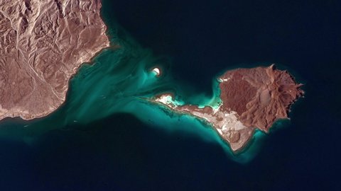 Scenic landscape of island in blue sea, aerial satellite view from space of Isla Coronado Mexico Baja California, sunrise animation. Based on images furnished by Nasa