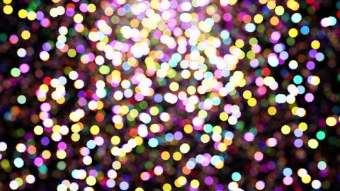 Realistic looping 3D animation of the shining colorful light particles circular bokeh rendered in UHD as motion background