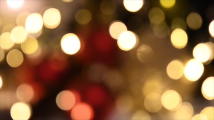 Christmas lights, shimmering abstract golden warm circles defocused. Blurred fairy lights. Out of focus holiday background. Light bokeh from Xmas tree. New Year theme, background 4k footage | Shutterstock HD Video #1082651419
