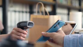 Pay by qr code on phone screen at coffee bar. Qr reader scans electronic card to transfer e-money of client wallet. Payment scanner in barista hands closeup. Male buyer in cafeteria or food market - Powered by Shutterstock - Get 15% off with code: PIKWIZARD15