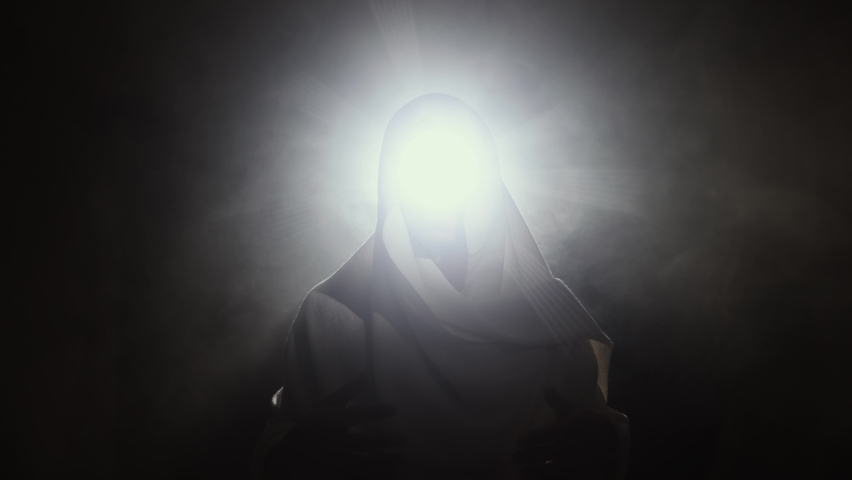 Light comes from the face of God Royalty-Free Stock Footage #1082670970
